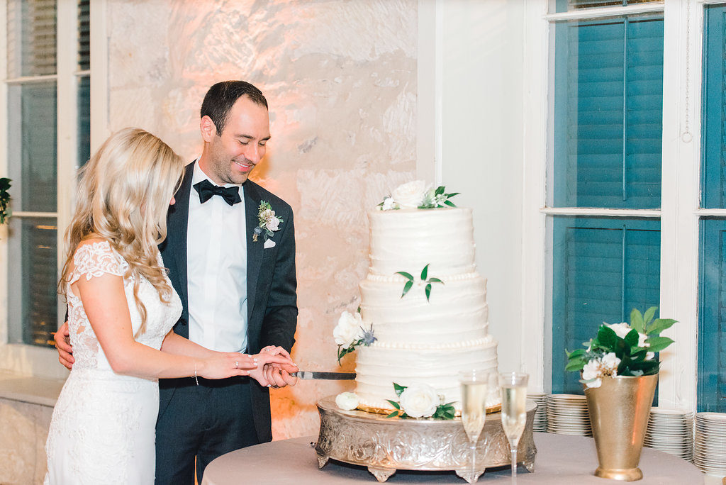 Touch of Whimsy | Cake cutting inspiration at an elegant wedding at Southwest School of Art in San Antonio. Planning by New Braunfels wedding planner Kelsea Vaughan